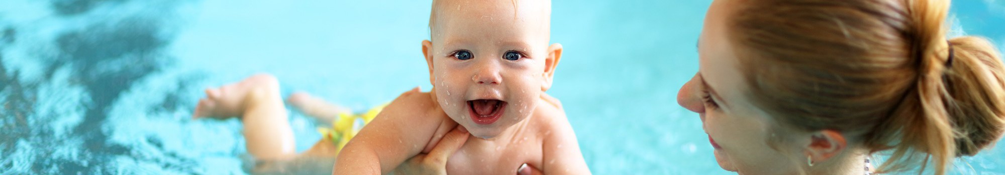 Parent Holding Baby In Front Hold